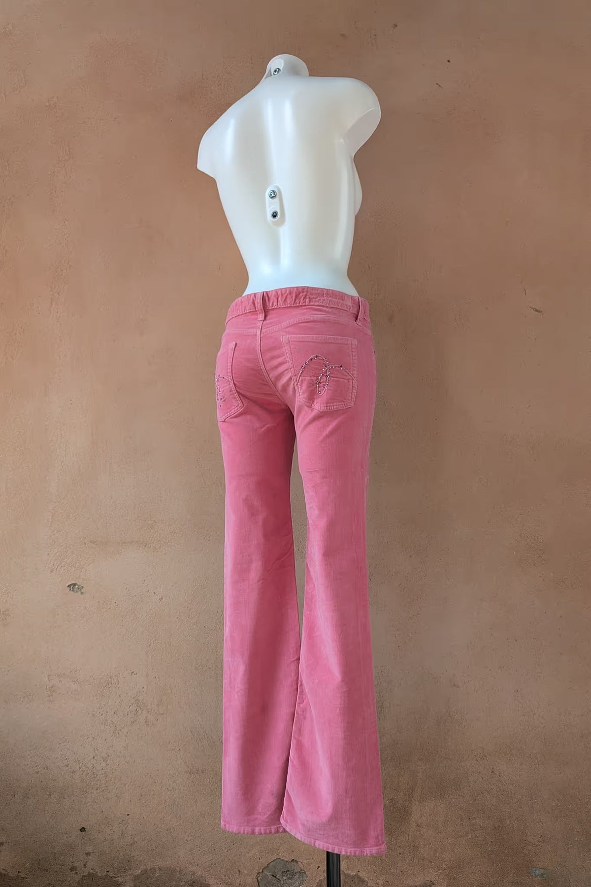 Rose pink corduroy pants, back view with embellished pockets