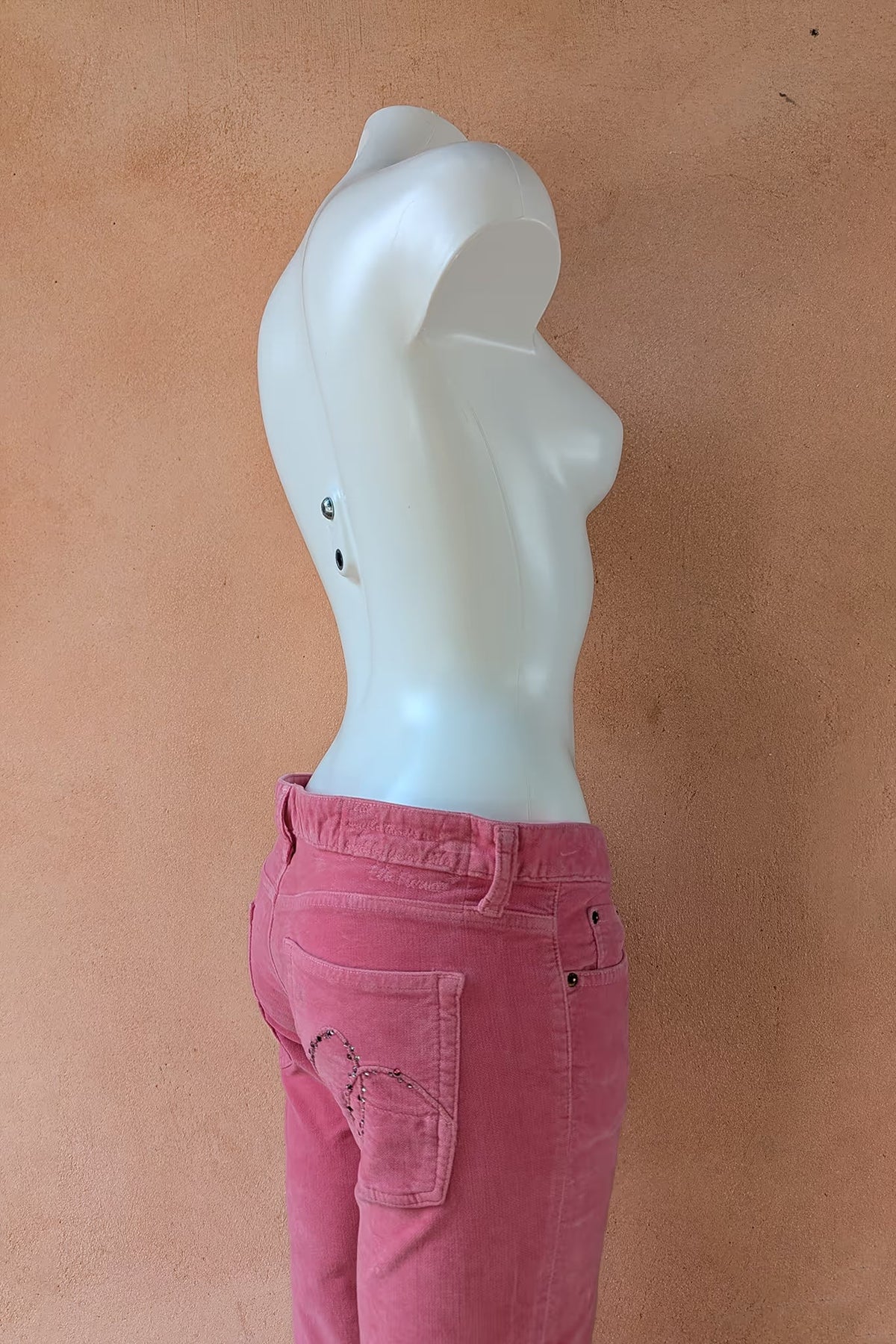 Rose pink corduroy pants, waistband and back pocket detail