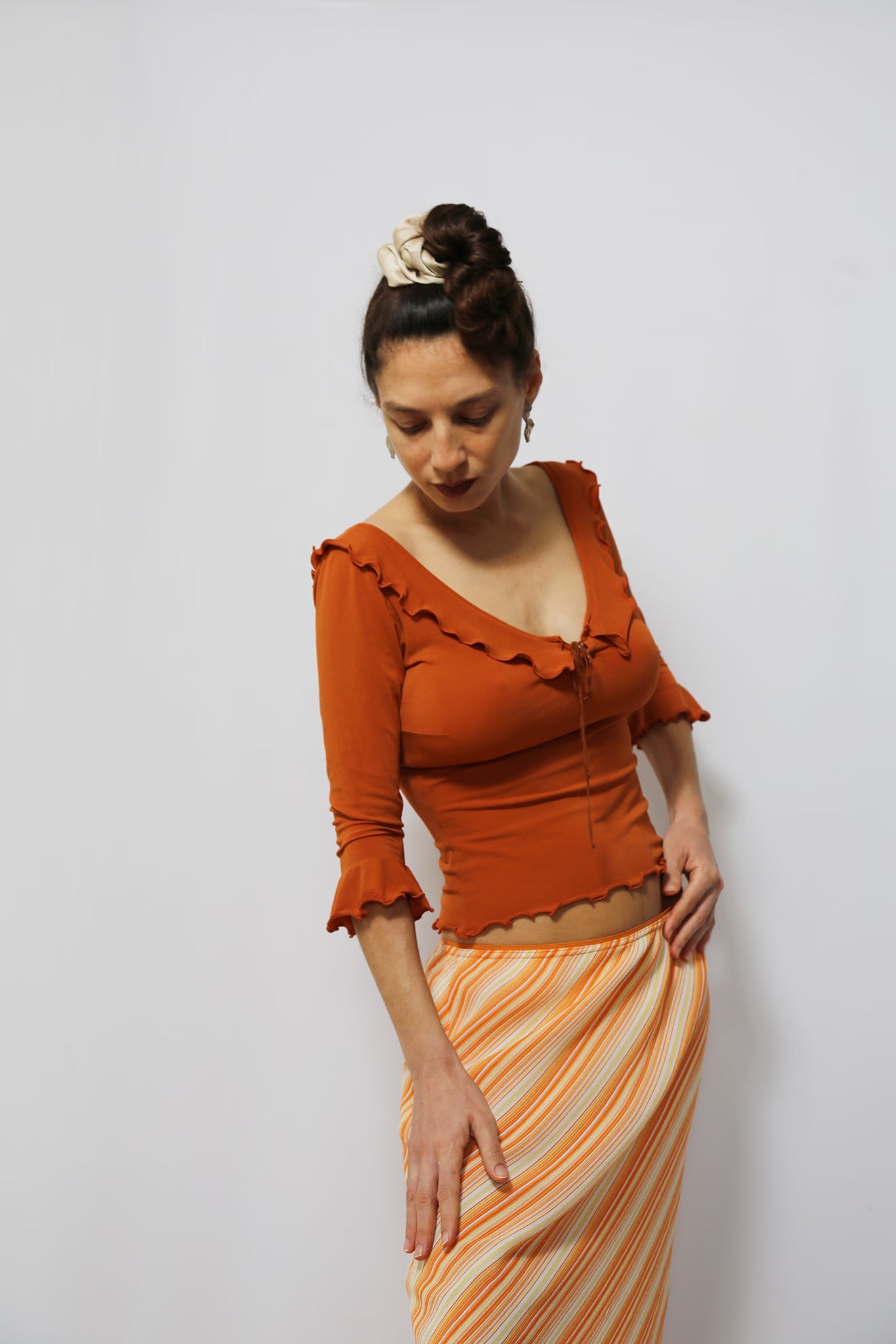 The Smokey-Orange Ruffled Stretch Top